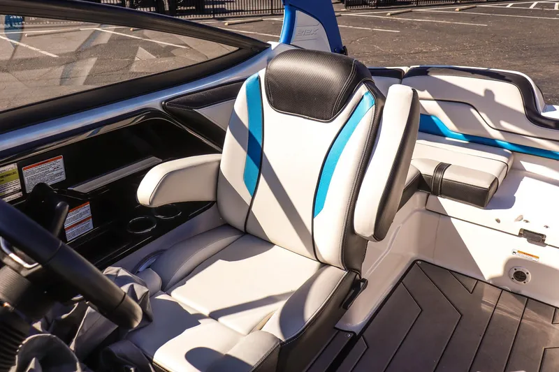 Slide: The Image of 2019 Yamaha Boats 212X interior with sleek, modern seating and stylish design. - 12