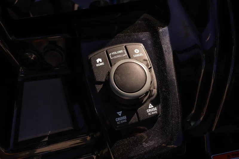 Slide: The Image of Close-up of 2019 Yamaha Boats 212X control panel with navigation buttons. - 16