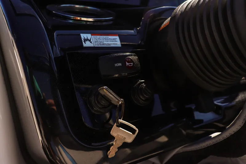 Slide: The Image of Close-up of 2019 Yamaha 212X boat ignition with key inserted. - 21
