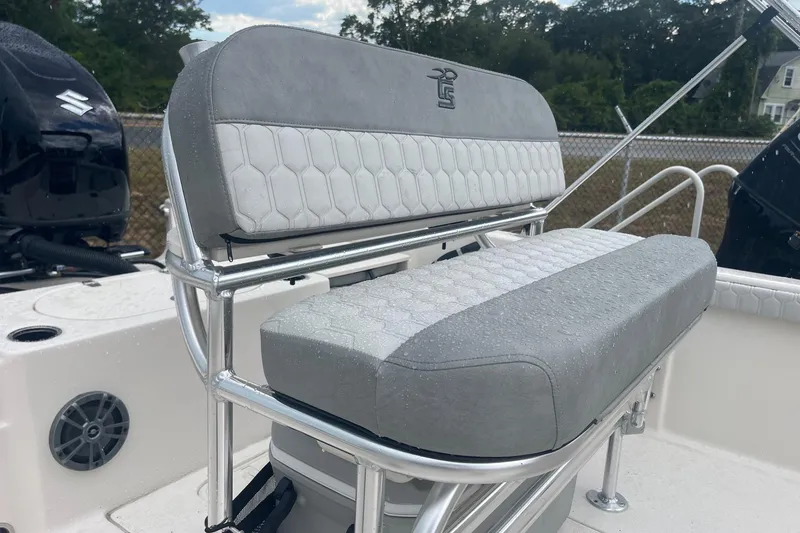 Slide: The Image of 2026 Carolina Skiff 19 LS boat seat with sleek design and water droplets. - 6
