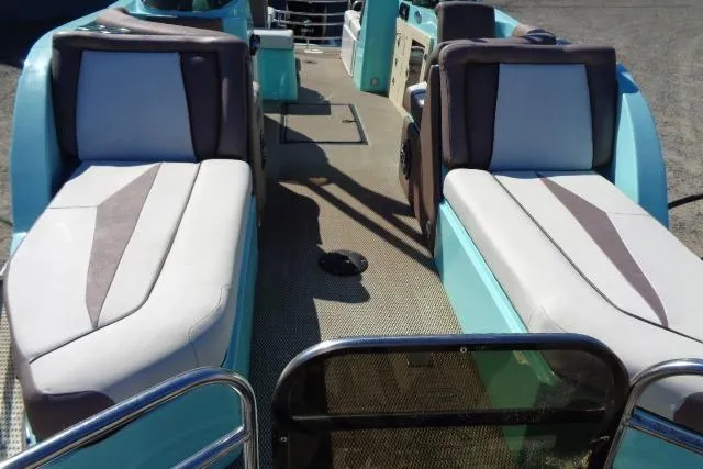 Slide: The Image of 2018 Caravelle Razor 238 PF boat interior with cushioned seating and modern design. - 12