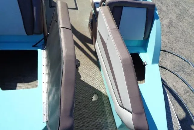 Slide: The Image of 2018 Caravelle Razor 238 PF boat interior with blue and gray seating. - 14