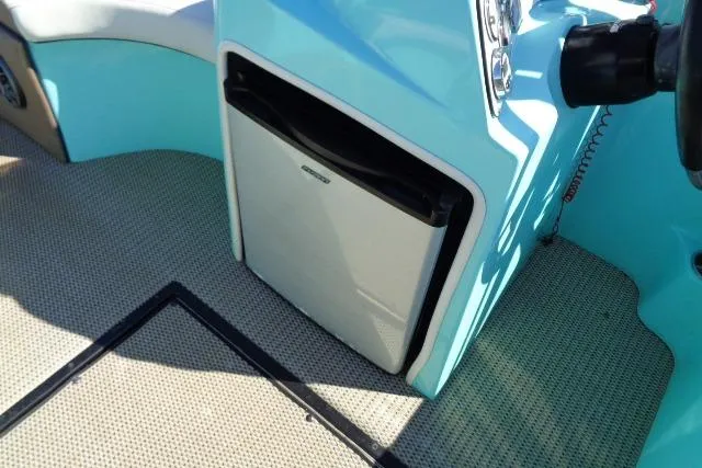 Slide: The Image of 2018 Caravelle Razor 238 PF interior with mini fridge and blue accents. - 17