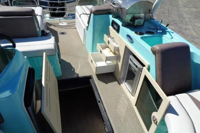 Slide: The Image of 2018 Caravelle Razor 238 PF interior with kitchenette and seating area. - 18