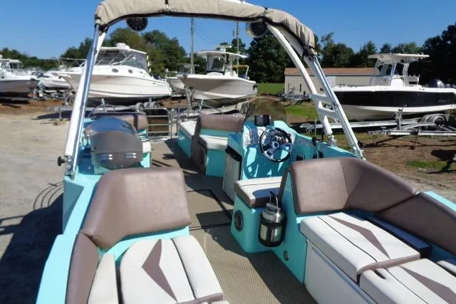 Slide: The Image of 2018 Caravelle Razor 238 PF boat with spacious seating and modern design. - 21