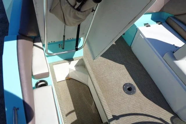 Slide: The Image of 2018 Caravelle Razor 238 PF boat interior with seating and storage compartments. - 22