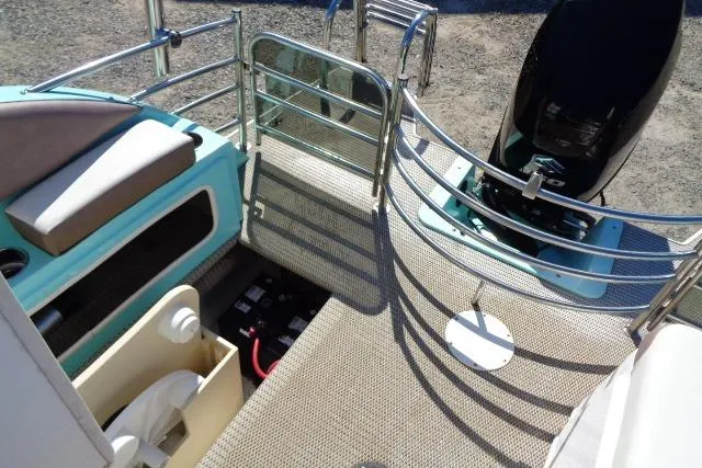 Slide: The Image of 2018 Caravelle Razor 238 PF boat interior with seating and motor, featuring modern design elements. - 24