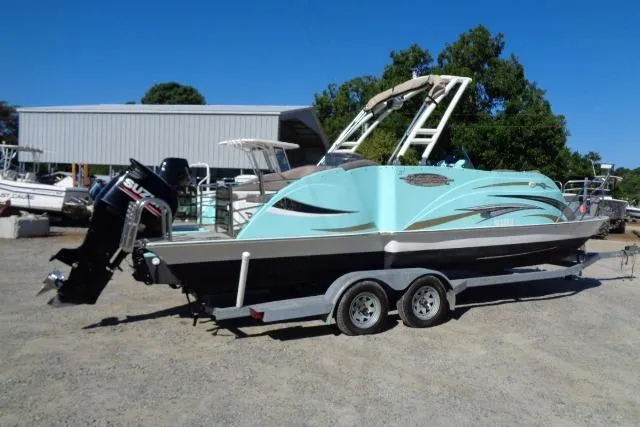 Slide: The Image of 2018 Caravelle Razor 238 PF boat on trailer, parked outdoors. - 3