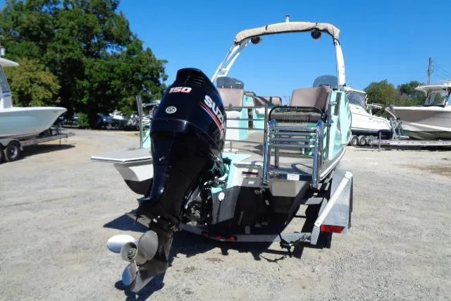 Slide: The Image of 2018 Caravelle Razor 238 PF boat with Suzuki outboard motor on trailer. - 4