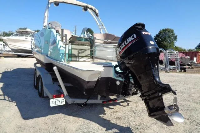 Slide: The Image of 2018 Caravelle Razor 238 PF boat with Suzuki 150 outboard motor on trailer. - 5