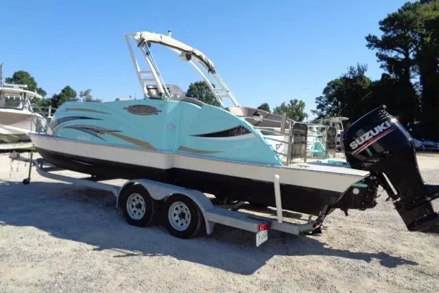Slide: The Image of 2018 Caravelle Razor 238 PF boat on trailer with Suzuki outboard motor. - 6