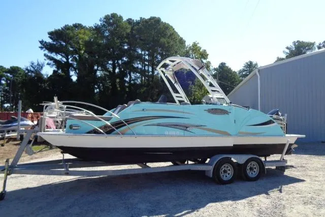 Slide: The Image of 2018 Caravelle Razor 238 PF boat on trailer, parked outdoors. - 8