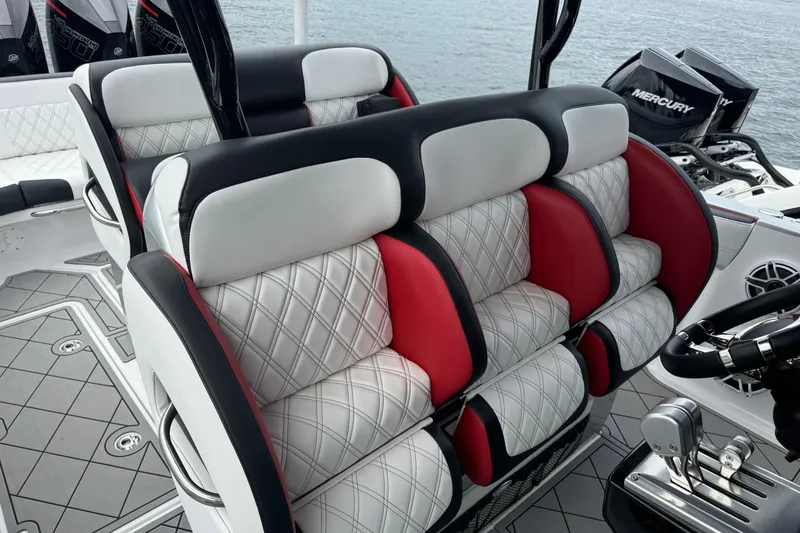 Slide: The Image of 2022 Nor-Tech 390 Sport Center Console interior with luxurious seating and Mercury engines. - 10