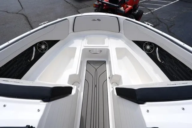 Slide: The Image of 2026 Sea Ray SPX 210 boat interior with sleek seating and modern design. - 10