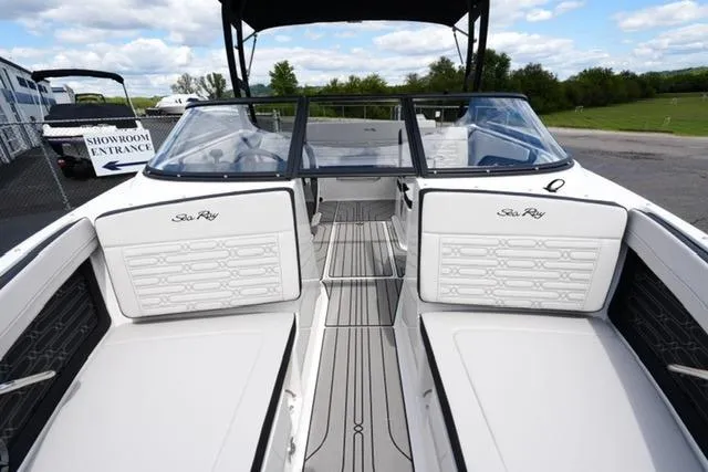 Slide: The Image of 2026 Sea Ray SPX 210 boat interior with white seating and sleek design. - 11