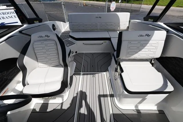 Slide: The Image of 2026 Sea Ray SPX 210 boat interior with white seating and modern design. - 15