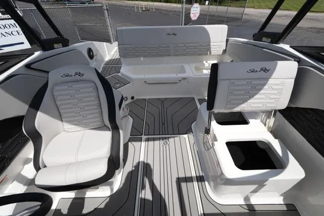 Slide: The Image of 2026 Sea Ray SPX 210 boat interior with white seating and modern design. - 16