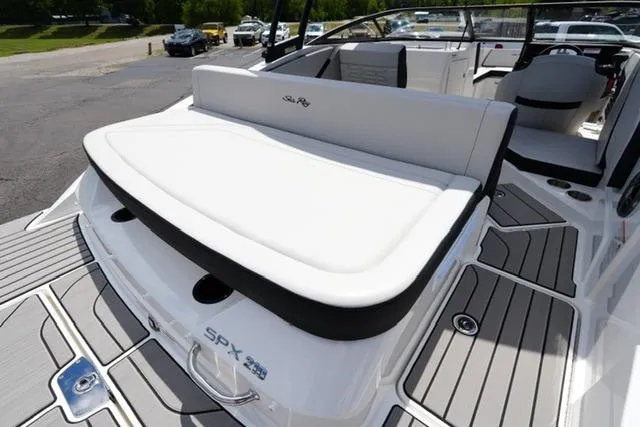 Slide: The Image of 2026 Sea Ray SPX 210 boat with sleek white seating and modern deck design. - 17
