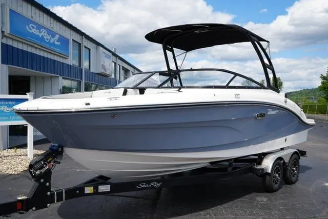 Slide: The Image of 2026 Sea Ray SPX 210 boat on trailer, displayed outdoors near dealership. - 3