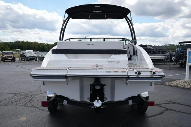Slide: The Image of 2026 Sea Ray SPX 210 boat rear view in a parking lot, showcasing sleek design. - 6