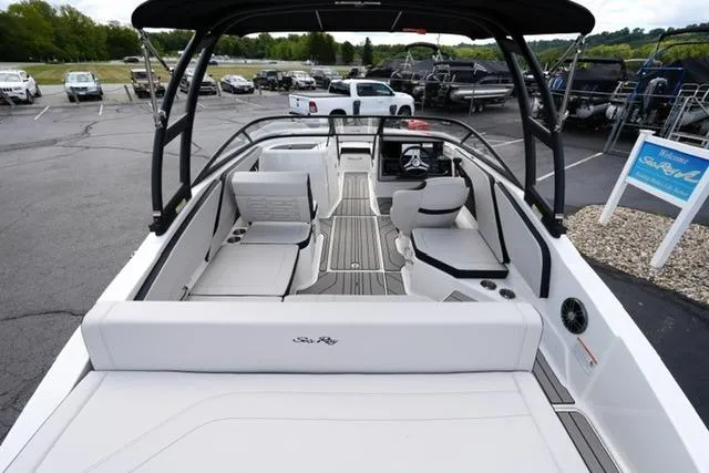 Slide: The Image of 2026 Sea Ray SPX 210 boat interior with sleek seating and modern dashboard. - 8