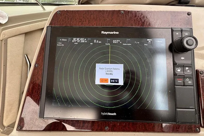 Slide: The Image of Raymarine radar display on 2011 Sea Ray 370 Sundancer boat, showing navigation interface. - 19