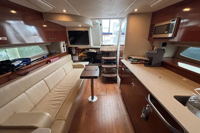 Slide: The Image of Luxurious interior of a 2011 Sea Ray 370 Sundancer yacht with modern amenities. - 27