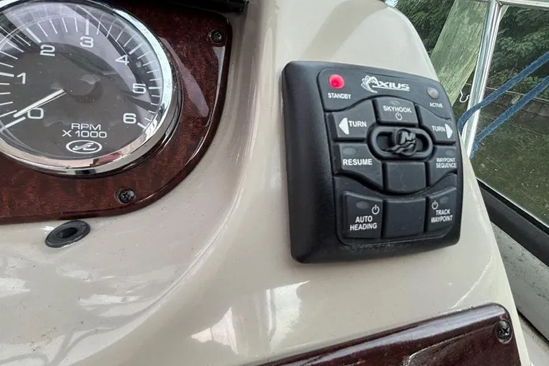 Slide: The Image of Control panel and RPM gauge on 2011 Sea Ray 370 Sundancer boat dashboard. - 6