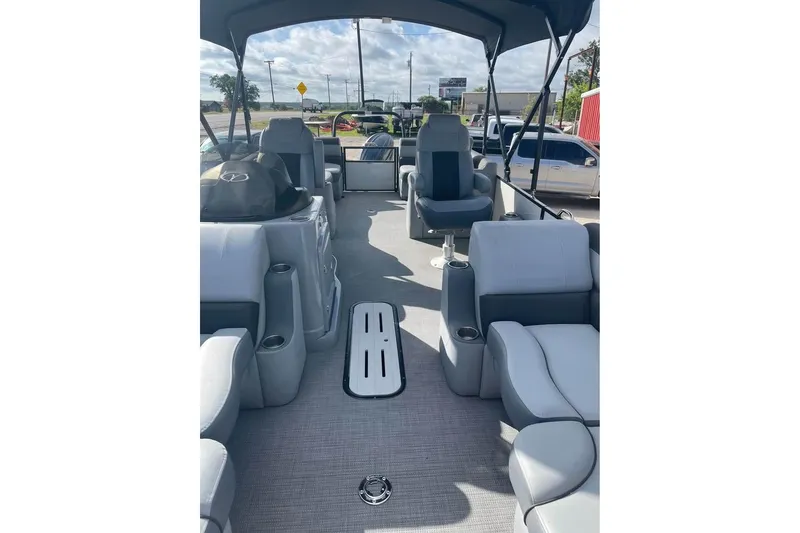Slide: The Image of 2024 Veranda Relax VR22RC pontoon boat interior with plush seating and canopy. - 4