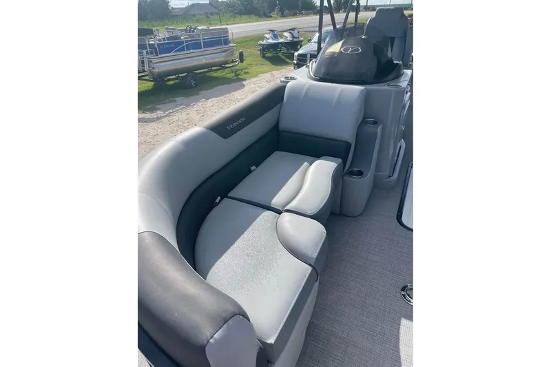 Slide: The Image of 2024 Veranda Relax VR22RC pontoon boat interior with plush seating and modern design. - 5
