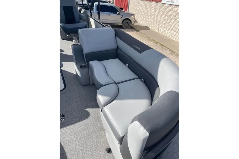 Slide: The Image of 2024 Veranda Relax VR22RC boat interior with gray seating and cup holders. - 6