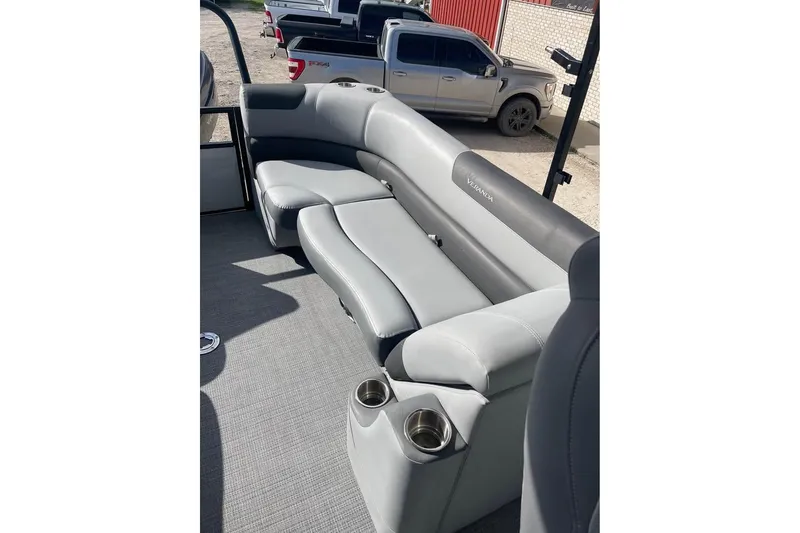 Slide: The Image of 2024 Veranda Relax VR22RC pontoon boat with luxurious gray seating and cup holders. - 9