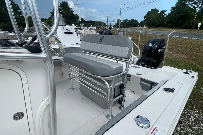 Slide: The Image of 2026 Carolina Skiff 22 Ultra Elite boat interior with seating and Suzuki outboard motor. - 14
