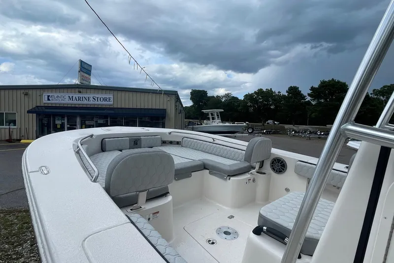 Slide: The Image of 2026 Carolina Skiff 22 Ultra Elite boat at Atlantic Marine Store under cloudy skies. - 15