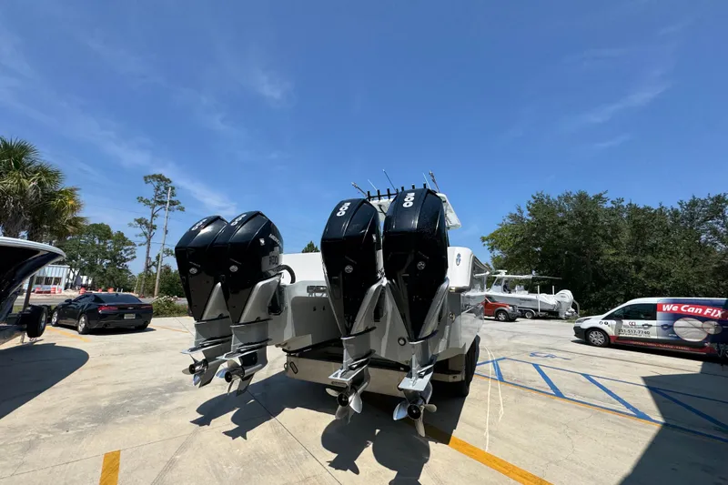 Slide: The Image of 2021 Invincible 35' Catamaran with triple outboard engines on trailer. - 13