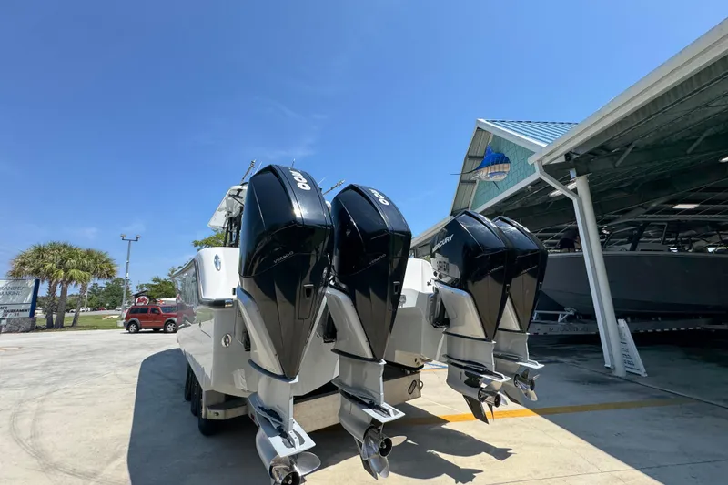 Slide: The Image of 2021 Invincible 35' Catamaran with triple outboard engines at a marina. - 15