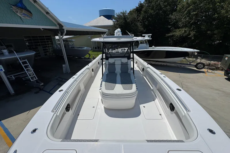 Slide: The Image of 2021 Invincible 35' Catamaran docked, showcasing spacious deck and modern design. - 18