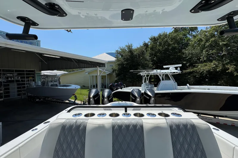 Slide: The Image of Luxurious seating on 2021 Invincible 35' Catamaran with diamond-stitched upholstery and cup holders. - 27