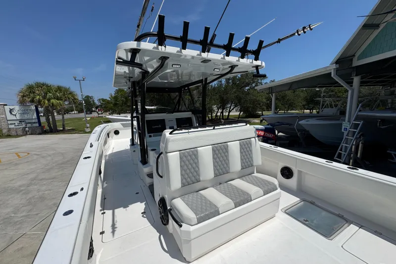 Slide: The Image of 2021 Invincible 35' Catamaran helm with Garmin and Mercury navigation systems. - 31