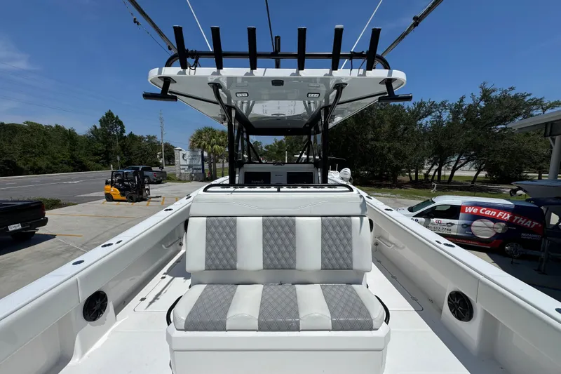 Slide: The Image of 2021 Invincible 35' Catamaran cockpit with Garmin and Mercury controls, outdoor view. - 32