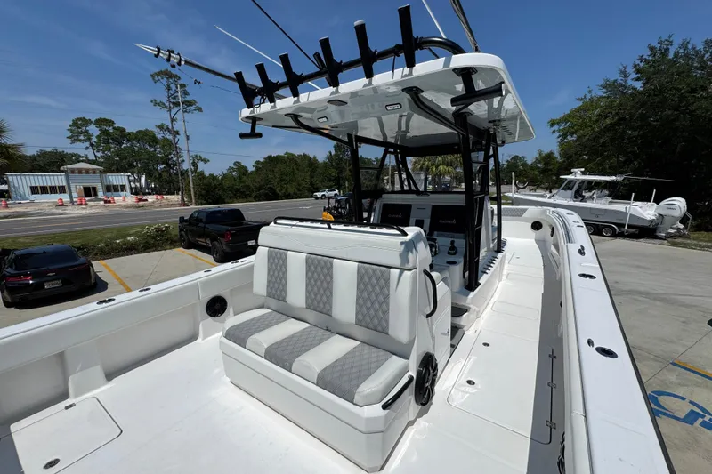 Slide: The Image of 2021 Invincible 35' Catamaran helm with Garmin navigation and Mercury controls. - 33