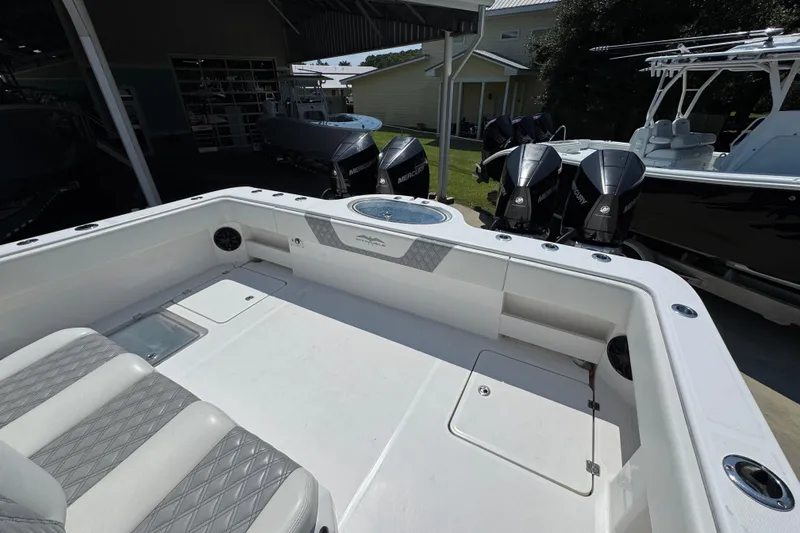 Slide: The Image of 2021 Invincible 35' Catamaran interior with plush seating and modern helm controls. - 34