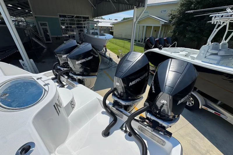 Slide: The Image of 2021 Invincible 35' Catamaran with seating and fishing equipment, parked outdoors. - 37