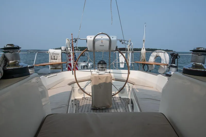 Slide: The Image of Cockpit view of 2002 Tartan 4100 sailboat on calm waters. - 21