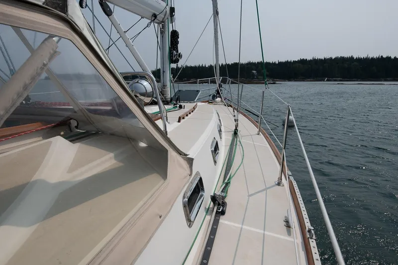 Slide: The Image of Sailing yacht Tartan 4100, 2002 model, cruising on calm waters. - 23