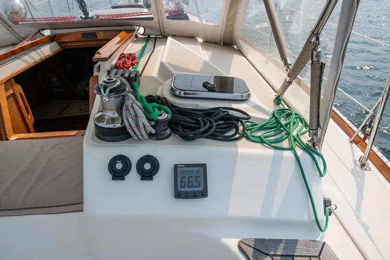 Slide: The Image of Cockpit of 2002 Tartan 4100 sailboat with ropes, winch, and digital display. - 31