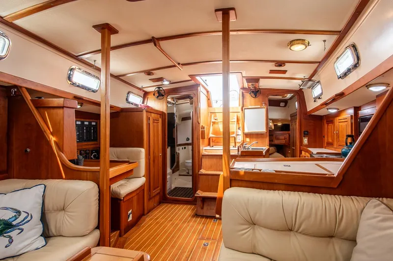 Slide: The Image of Luxurious interior of 2002 Tartan 4100 sailboat with wood finish and comfortable seating. - 33