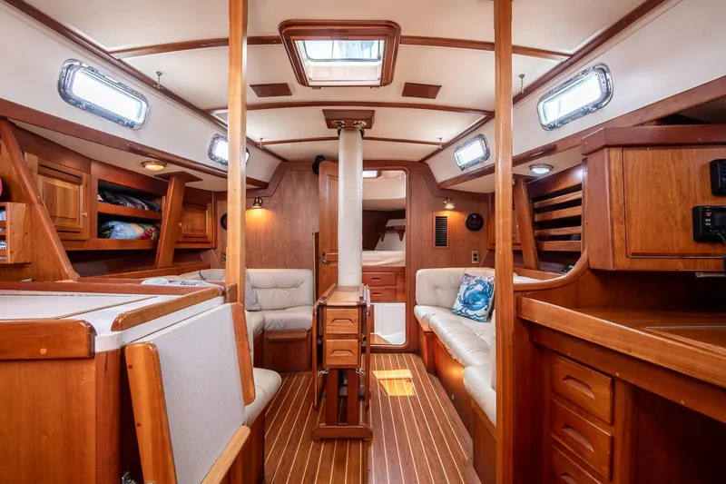 Slide: The Image of Luxurious 2002 Tartan 4100 yacht interior with wood finish and comfortable seating. - 43