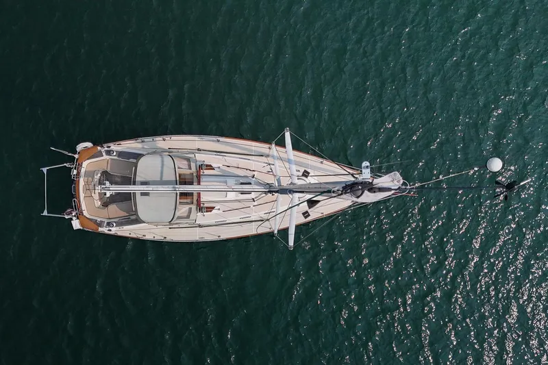 Slide: The Image of Aerial view of 2002 Tartan 4100 sailboat on calm water. - 5