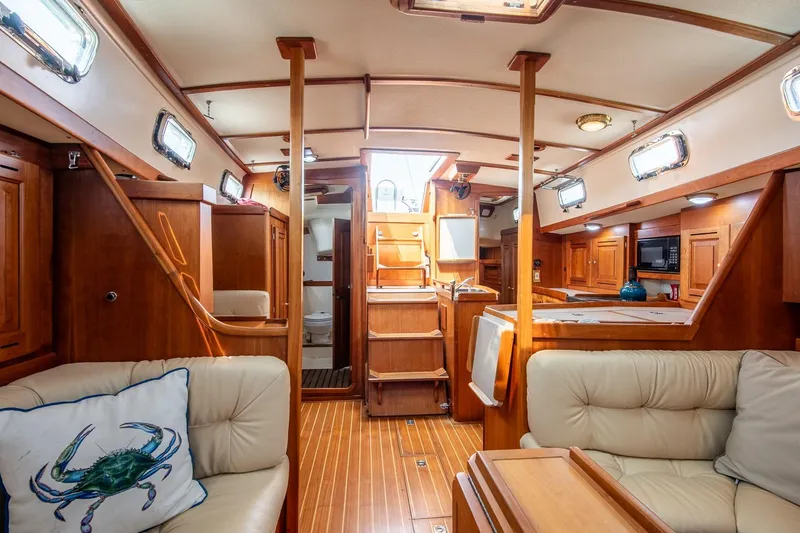 Slide: The Image of Luxurious 2002 Tartan 4100 yacht interior with wood finish and comfortable seating. - 55